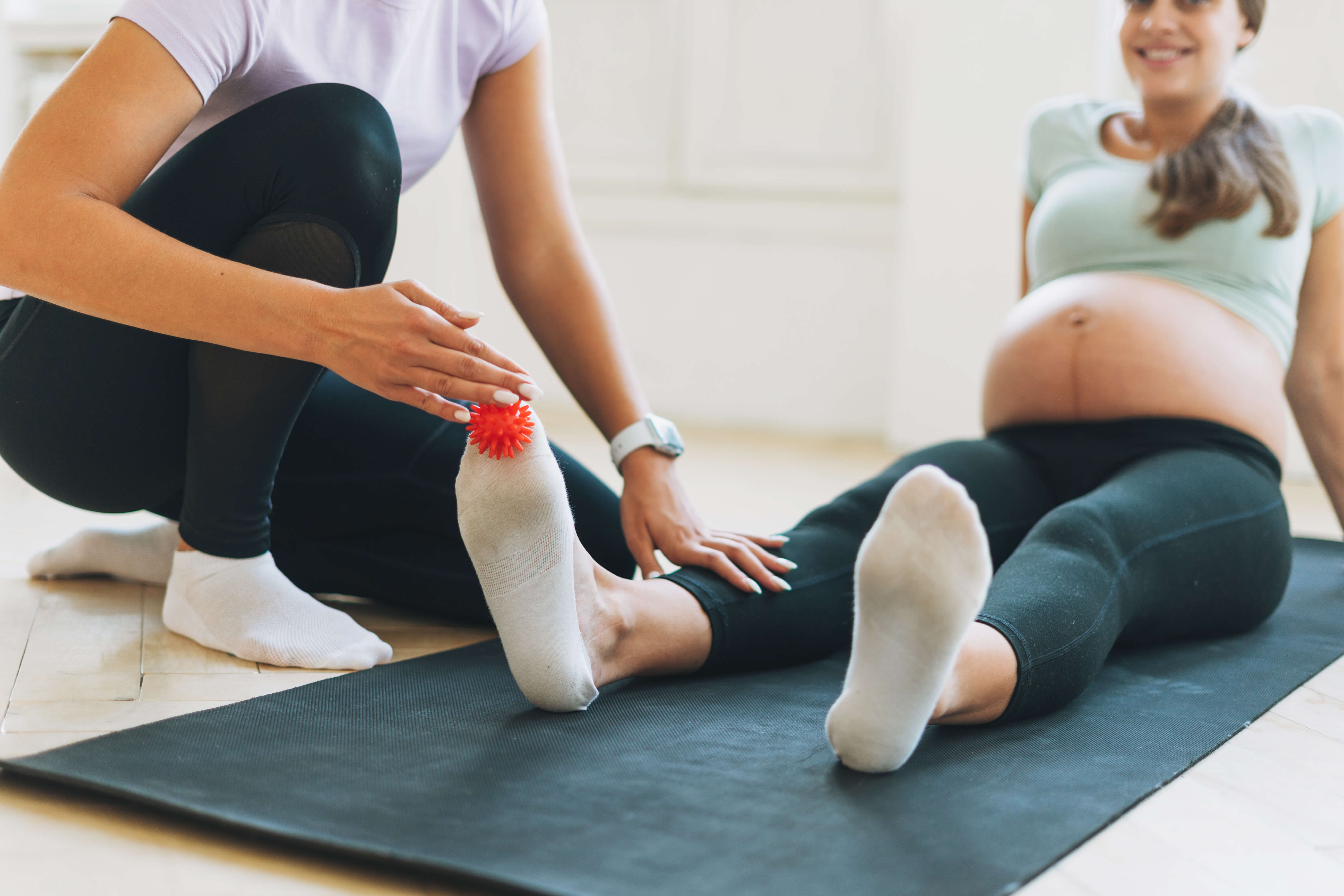 (https://elements.envato.com/the-trainer-massages-pregnant-womans-feet-with-spi-28DES25)